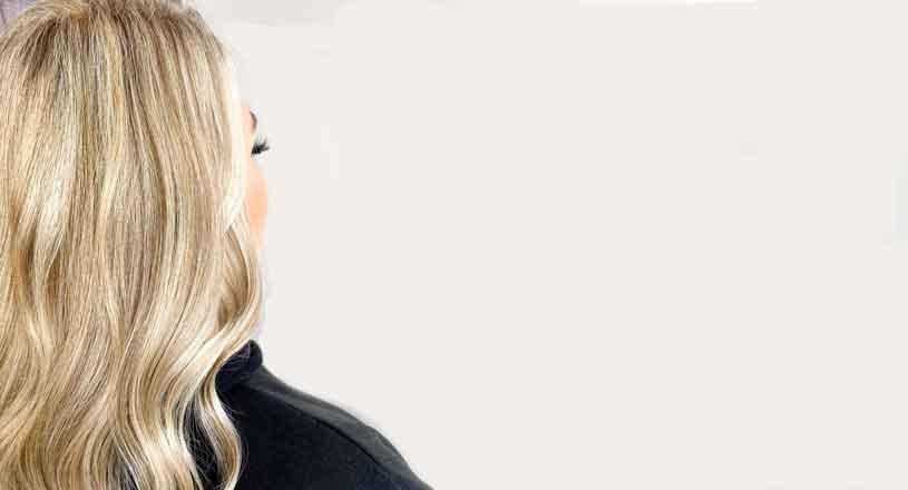 Girl facing backwards showing her blonde hair